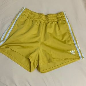 Yellow adidas athletic running shorts